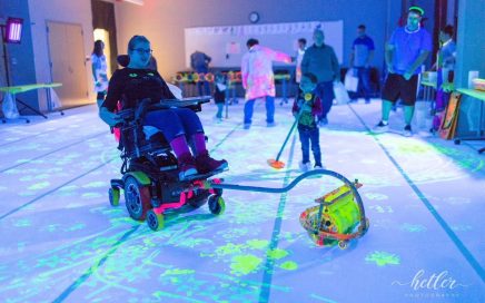 Art Star adding his design to the painting, using the Zot Art Wheelchair painting tool